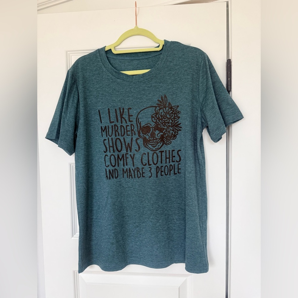 Teal Graphic Tee with Skull and Floral Design